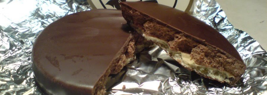 Heidelberger Studentenkuss chocolate praline cut open showing nougat filling on waffle base