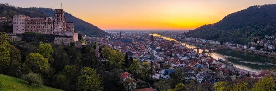 Heidelberg Castle at sunset overlooking Old Town and the Neckar River in Heidelberg Germany