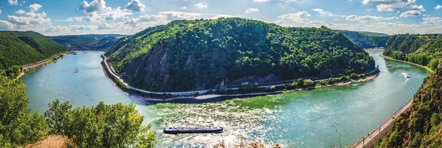 Rhine Gorge S-curve river bend near Boppard with cruise ship sailing through the Upper Middle Rhine Valley Germany